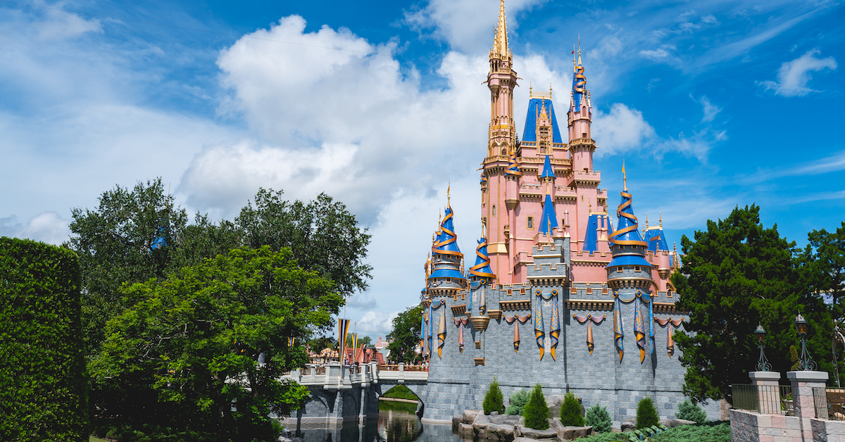081221_Magic-Kingdom_Cinderella-Castle-side-From-Tomorrowland-Bridge_Cliff-Wang (FI) About Us, Dad's Guide to WDW, Cinderella Castle exterior on a sunny day
